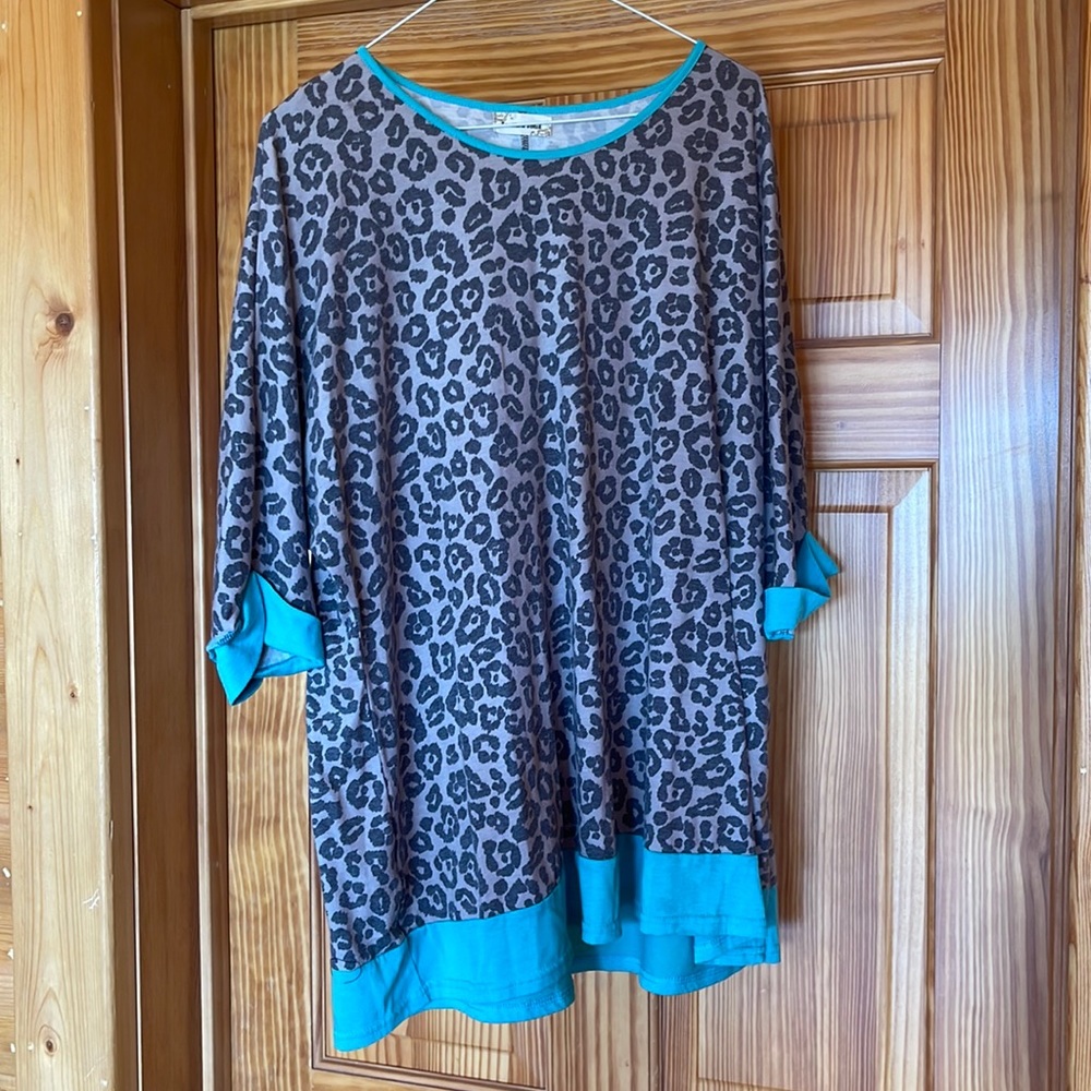 Size XL leopard print with blue accents worn a couple of times